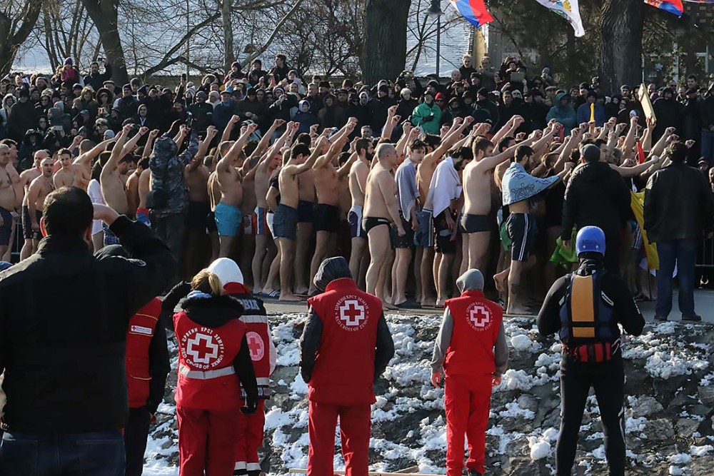 The banks of the Danube. Swimmers fortify themselves with prayer and singing. 