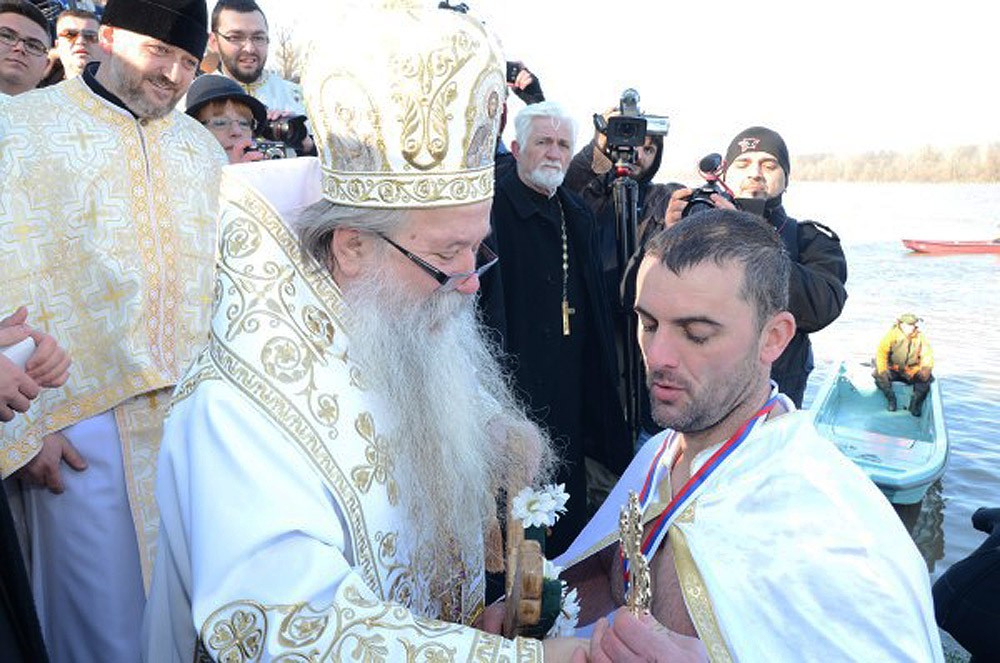 Brcko. Bishop Hryzostom of Zvornik and Tuzla awards the winner, Drasko Dzukic. 