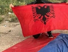 Kosovo Albanian steals, tramples on Serbian Church flag
