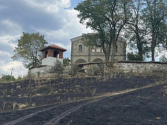 Bulgarians see a miracle as wildfire dies out just before village church